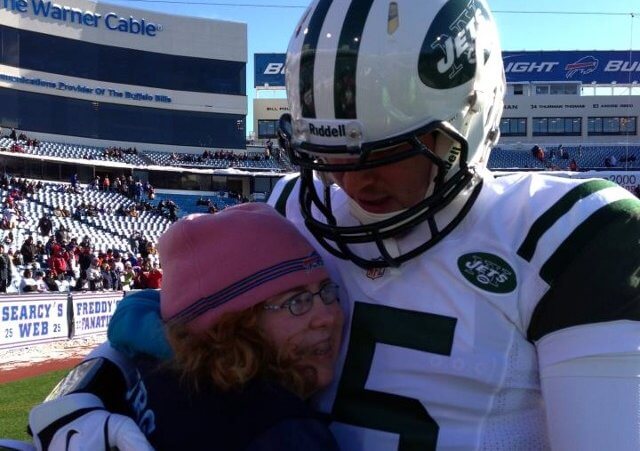 Tim Tebow and Wish 15 program recipient, Maggie, enjoys a pre-game hug before the December 30, 2012 Jets vs Bills game (Credit: Tim Tebow Foundation)