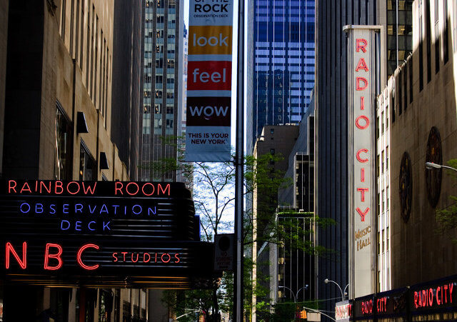 A view down 49th Street in New York City, Rockefeller Center, home to NBC Studios and Saturday Night Live, The Rainbow Room and Radio City Music Hall (Credit: Kirill Levin via Flickr)