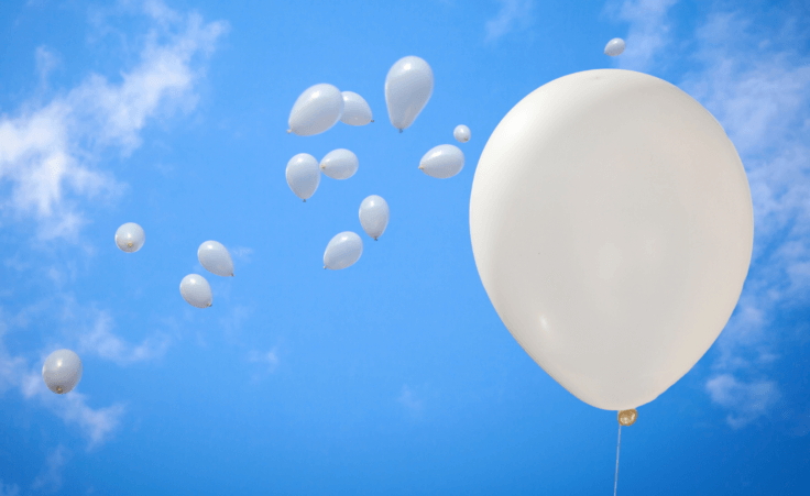 White balloons in a blue sky. By MarcoScisetti/stock.adobe.com North Korea South Korea