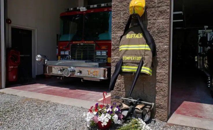 Flowers and a tribute to fallen firefighter Corey Comperatore are pictured at the Buffalo Township Volunteer Fire Company in Buffalo Township, Pa., Monday, July 15, 2024. Comperatore was shot and killed at the Trump rally in Butler, Pa., Saturday, July 13, 2024. (AP Photo/Sue Ogrocki)