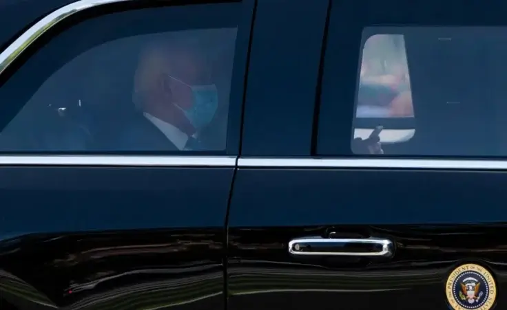President Joe Biden wears a mask while returning to the White House from his Rehoboth Beach home after recovering from a COVID-19 infection, Tuesday, July 23, 2024, in Washington. (AP Photo/Julia Nikhinson)
