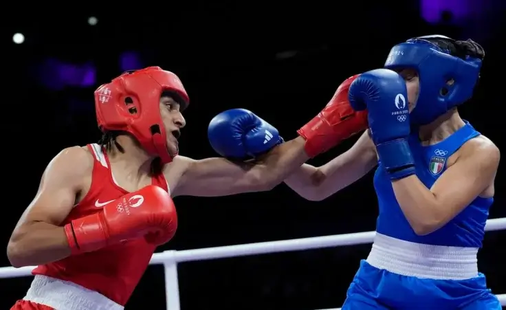 Algeria's Imane Khelif, left, fights Italy's Angela Carini in their women's 66kg preliminary boxing match at the 2024 Summer Olympics, Thursday, Aug. 1, 2024, in Paris, France. (AP Photo/John Locher)