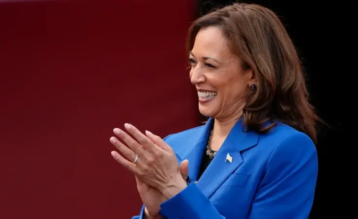 Democratic presidential nominee Vice President Kamala Harris greets members of the Aliquippa High School football team during a campaign stop at their school, Sunday, Aug. 18, 2024, in Aliquippa, Pa. (AP Photo/Julia Nikhinson)