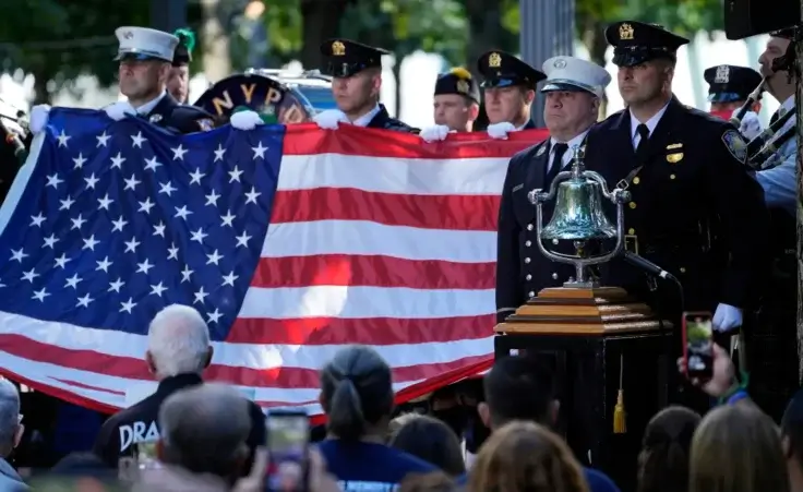 A New York Police Department honor guard holds an American flag during a 9/11 commemoration ceremony at Ground Zero, in New York, Wednesday, Sept. 11, 2024. (AP Photo/Jacquelyn Martin) Ground zero 9/11 anniversary