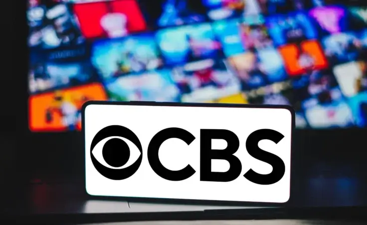 In this photo illustration, the Columbia Broadcasting System (CBS) logo is displayed on a smartphone screen. By RafaelHenrique/stock.adobe.com.