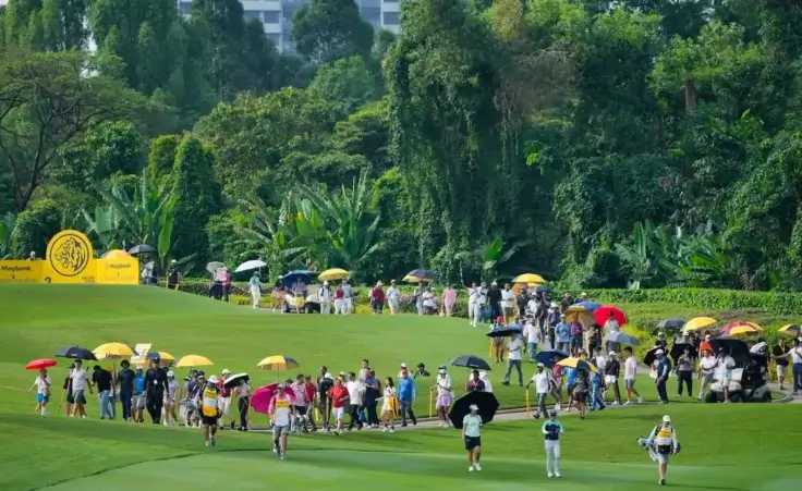 Yuka Saso of Japan, second right in front, walks on the 2nd fairway during the first round of Maybank LPGA Championship golf tournament at Kuala Lumpur Golf and Country club in Kuala Lumpur, Thursday, Oct. 24, 2024. (AP Photo/Vincent Thian)