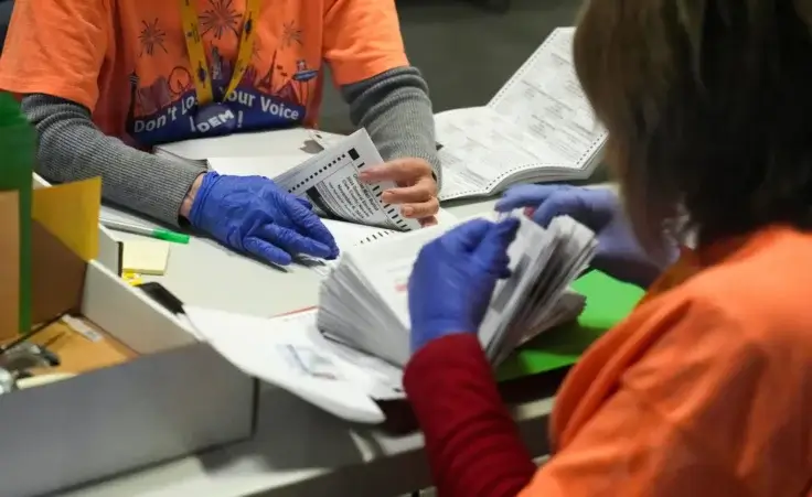 County workers sort through ballots in the extraction and inspection area at the Clark County Election Department, Saturday, Nov. 2, 2024, in North Las Vegas, Nev. (AP Photo/John Locher) End of America