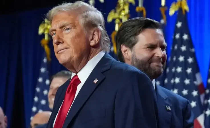 Republican presidential nominee former President Donald Trump and his running mate Sen. JD Vance, R-Ohio, stand on stage at an election night watch party at the Palm Beach Convention Center, Wednesday, Nov. 6, 2024, in West Palm Beach, Fla. (AP Photo/Evan Vucci) Trump wins election