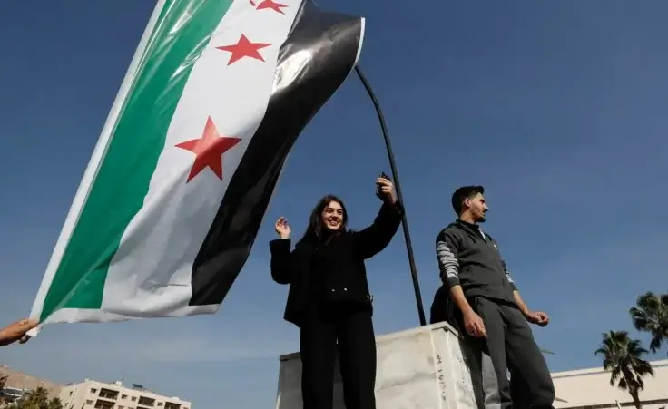 Syrians celebrate at Omayyad Square in Aleppo, Syria, Monday, Dec. 9, 2024. (AP Photo/Omar Sanadiki)