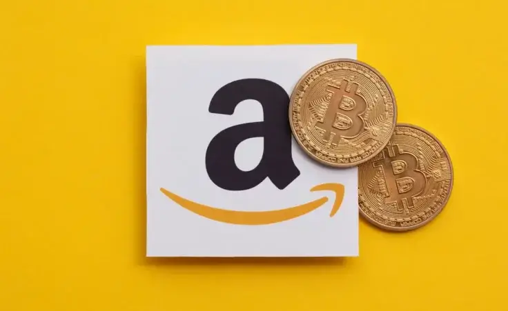 Bitcoin cryptocurrency on an amazom e-commerce logo. By ink drop/stock.adobe.com