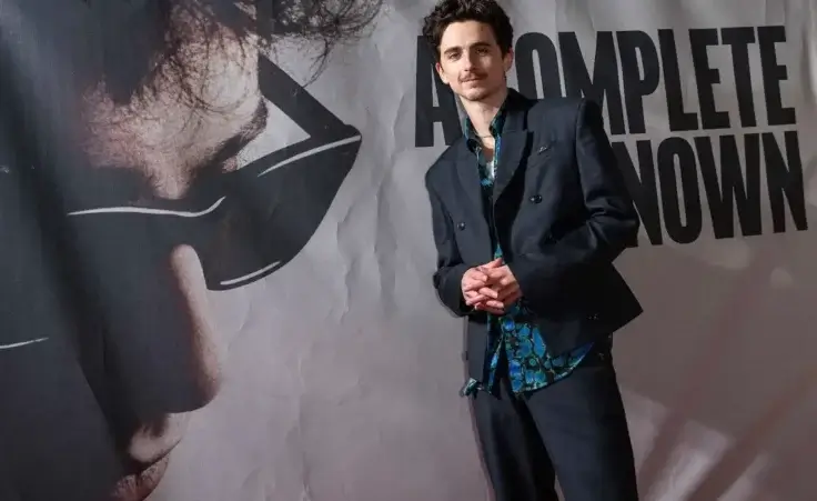 Timothee Chalamet poses for photographers upon arrival at the premiere of the film 'A Complete Unknown' in London, on Tuesday, Jan. 14, 2025. (Photo by Scott A Garfitt/Invision/AP)