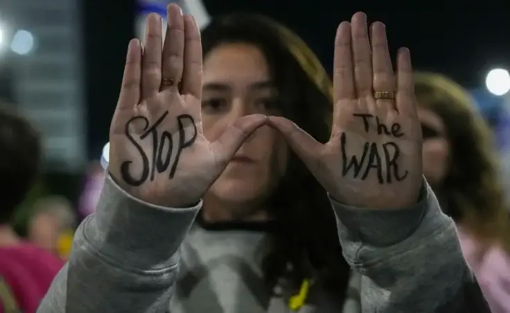 Israelis protest against Prime Minister Benjamin Netanyahu's government and call for the release of hostages held in the Gaza Strip by the Hamas militant group, in Tel Aviv, Israel, Saturday, Dec. 14, 2024. (AP Photo/Tsafrir Abayov) Ceasefire Israel