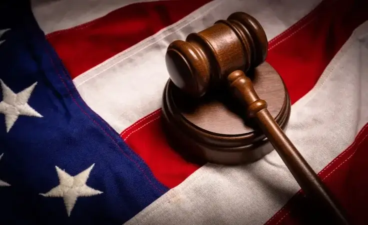 Judges gavel and an American flag -justice theme By Michael Flippo/stock.adobe.com