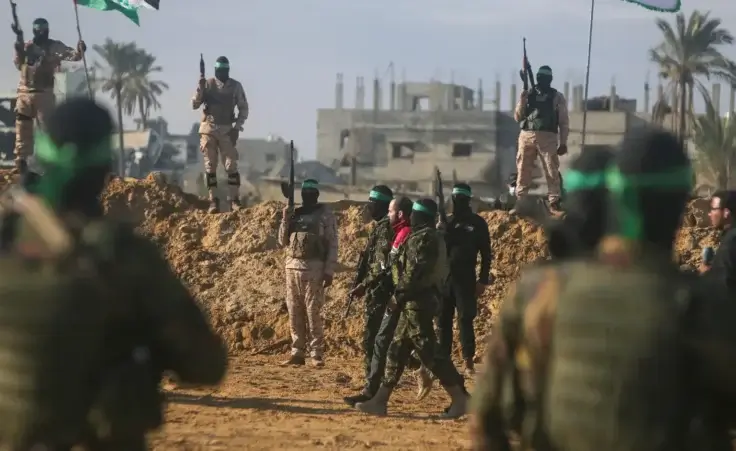 Israeli Yarden Bibas, 34, who has been held hostage by Hamas in Gaza since October 7, 2023, is escorted by Hamas fighters before being handed over to the Red Cross in Khan Younis, southern Gaza Strip, Saturday Feb. 1, 2025. (AP Photo/Jehad Alshrafi) Gaza deal