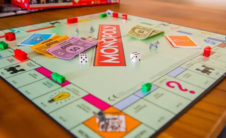 Close up of a Monopoly game board. By Haris Andronos/stock.adobe.com