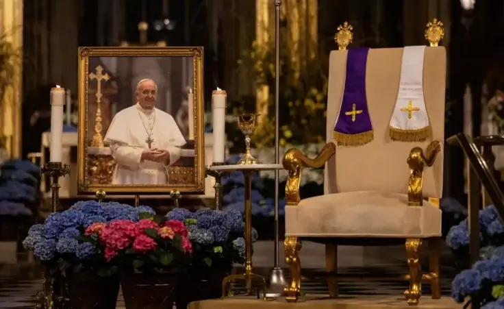 A picture of Pope Francis is displayed at St. Patrick's Cathedral, Monday, April 21, 2025, in New York. (AP Photo/Yuki Iwamura)